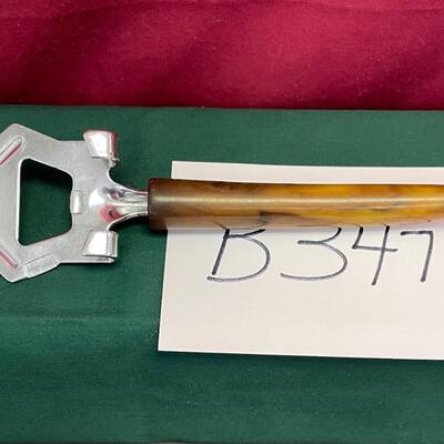 Vintage brown Bakelite bottle cap or can opener