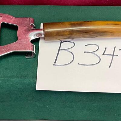 Vintage brown Bakelite bottle cap or can opener