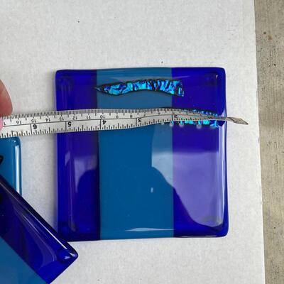 Glass trivet with artist signature