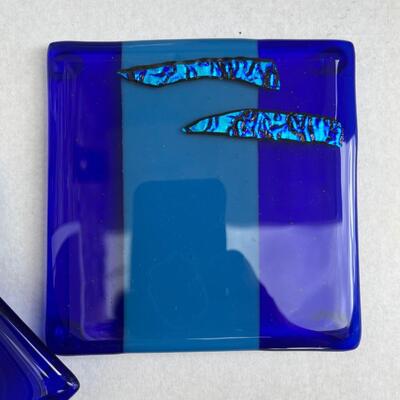 Glass trivet with artist signature