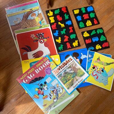 1B14 Puzzles, toys, cloth books, small childâ€™s rocking chair, miscellaneous
