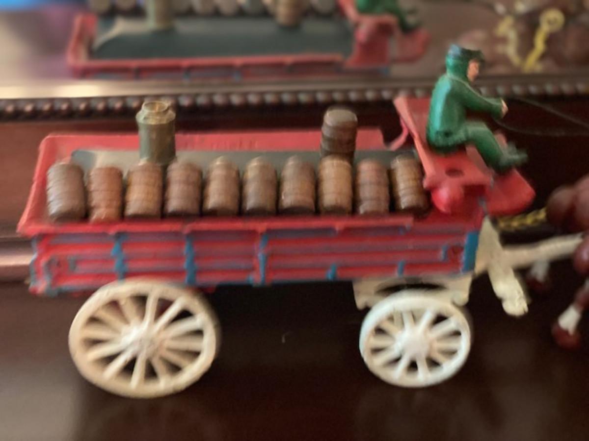 Vintage Cast Iron Wagon and Horses w/Wine Barrels | EstateSales.org