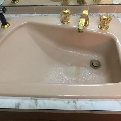 Vintage cast iron dusty pink bathroom sink with hose