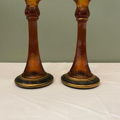 Pair of vintage amber glass fluted candlesticks