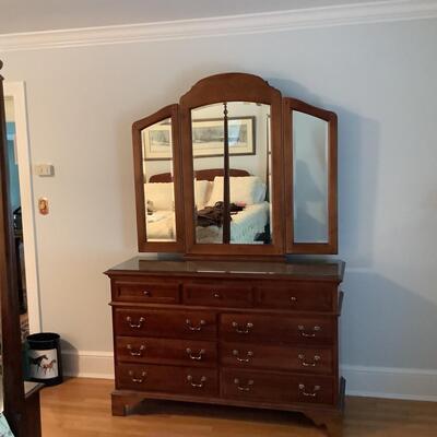 Lot  F - 1134  Sumter Cabinet Co. Glass-top Cherry Dresser with Trifold Beveled Mirror