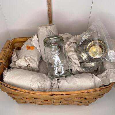 Wicker Basket of Mason Jars and Lids