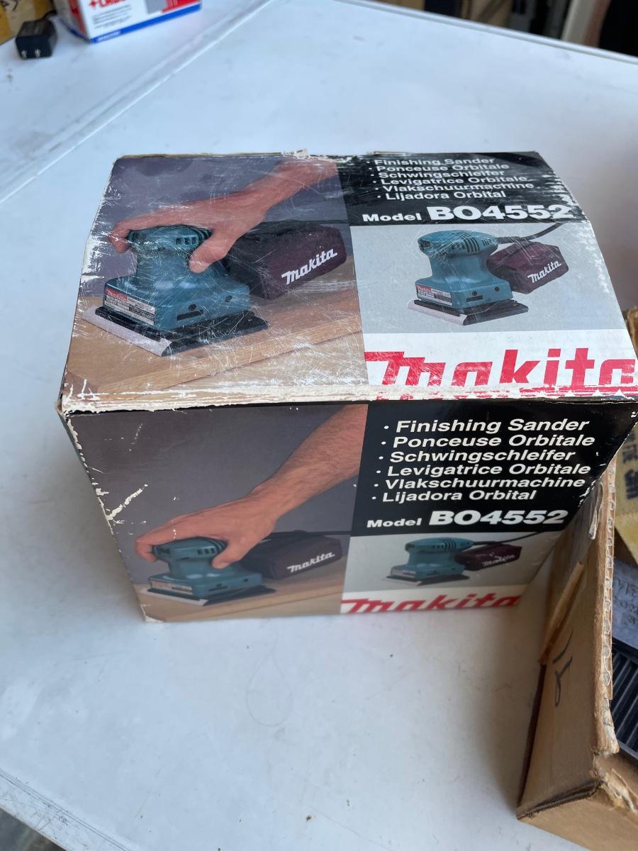 Lot 41. Makita Palm Sander with Sandpaper