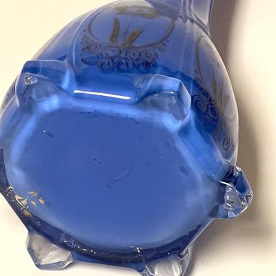 LOT 99  CASED BLUE GLASS BUD VASE PAINTED DESIGN.