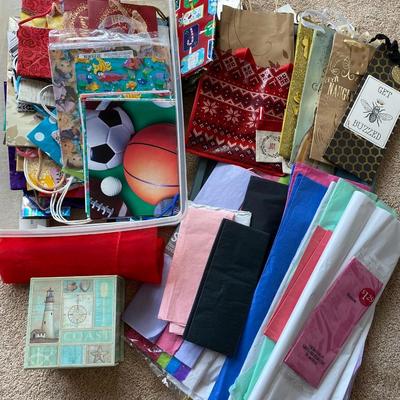 Lot 240.  Plastic Bin of Tissue and Gift Bags