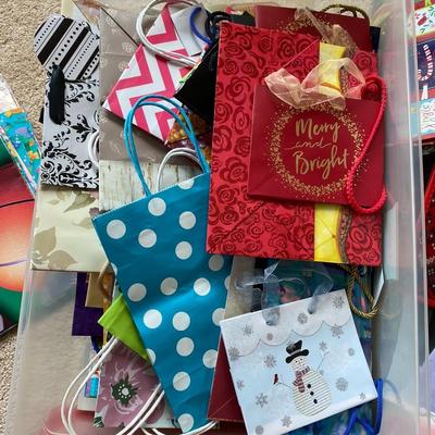 Lot 240.  Plastic Bin of Tissue and Gift Bags