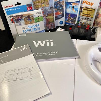 Lot 244.  Wii Accessories and Games