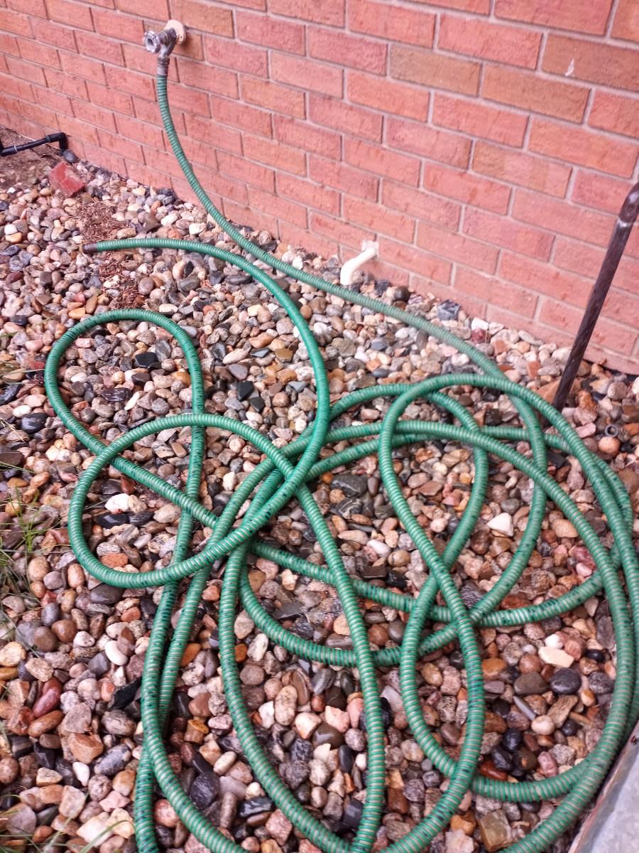 LOT 179 TWO GARDEN HOSES