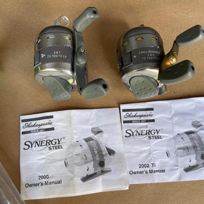 Lot 67. Two Synergy Reels and Rod/Reel Carrying System