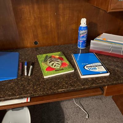 I-5- Desk w/some office supplies & trash can