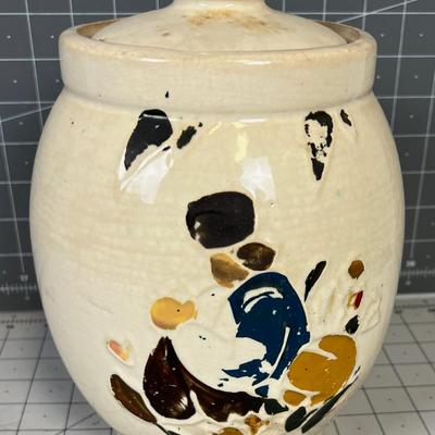 McCoy Cookie Jar / Canister with Applique Paint that is deteriorating. 