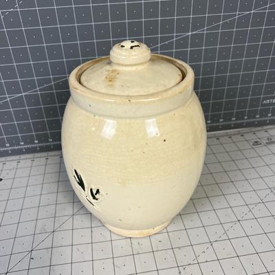 McCoy Cookie Jar / Canister with Applique Paint that is deteriorating. 