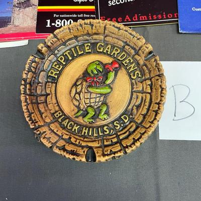 Travel brochures and ash tray