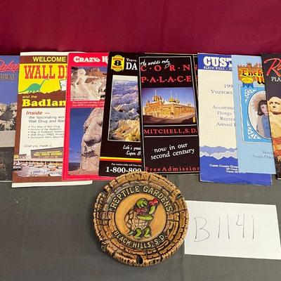 Travel brochures and ash tray