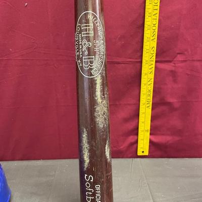 2 softball bats, Royals hat, and baseball