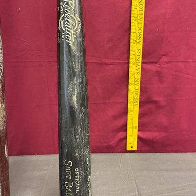 2 softball bats, Royals hat, and baseball