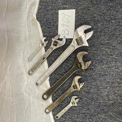 Adjustable crescent wrenches