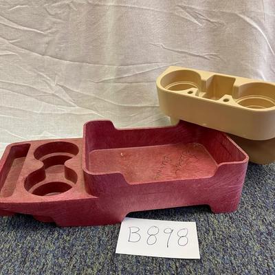 Storage console for automobiles