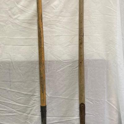 2 long handled shovels