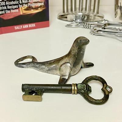 LOT 164  BARTENDER'S GROUP TOOLS OPENERS COASTERS & BOOK