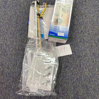 Walker wheels/dressing aid