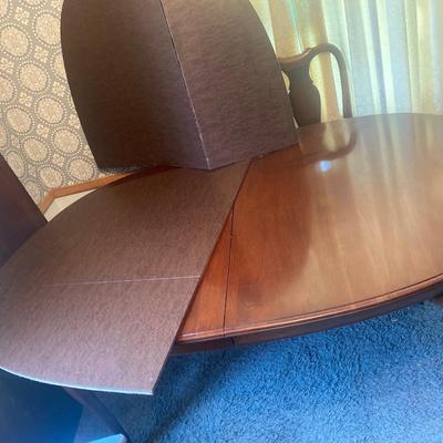 LR12 Table, 6 chairs, 2 captain chairs, two leaves, and removable table protector. 66â€ x 43â€x 29 1/2â€