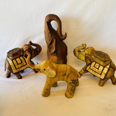 Four Wooden Carved Elephants