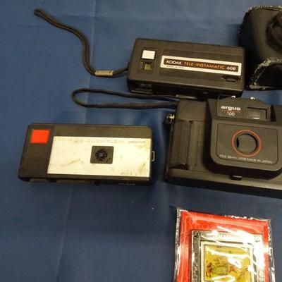 LOT 21 MISC ITEMS CAMERAS, DUMB BELLS AND DISNEY DECORATION
