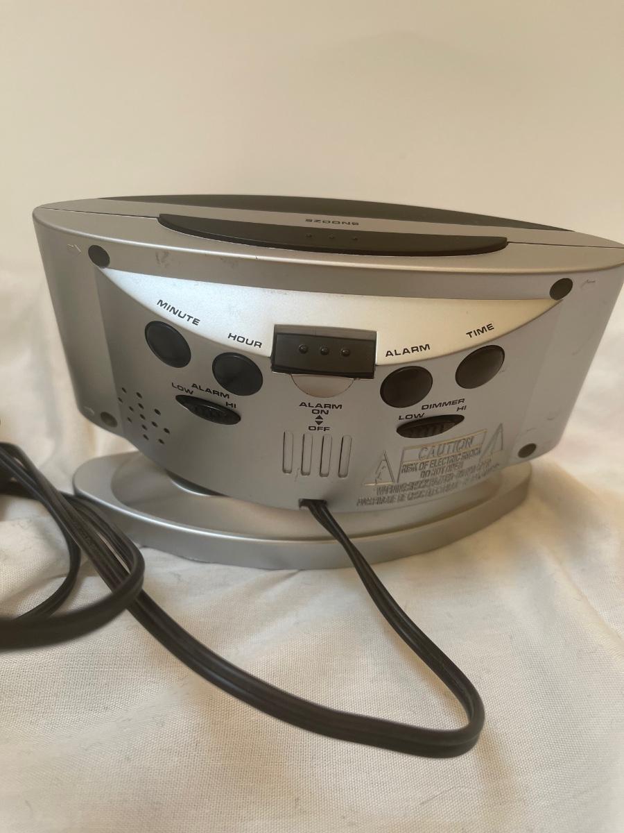 Sharp alarm clock. Model SPC033. Swivels. Use battery or electrical