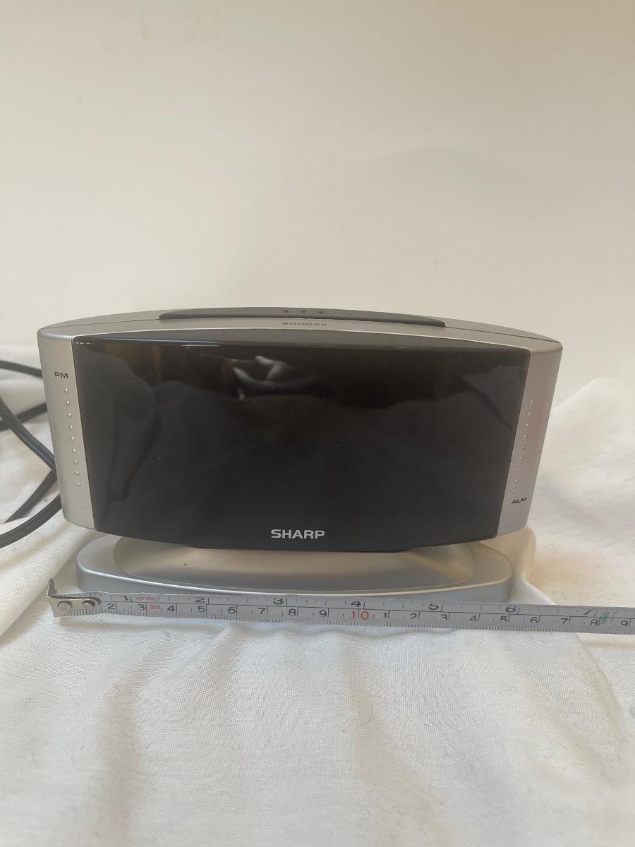 Sharp alarm clock. Model SPC033. Swivels. Use battery or electrical