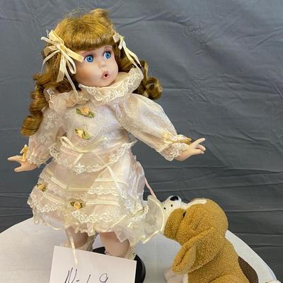 Oh! Puppy is Tearing my Dress Porcelain Doll