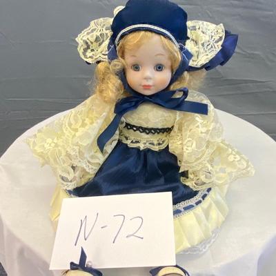 Blue Dressed Blonde Sitting Porcelain Doll