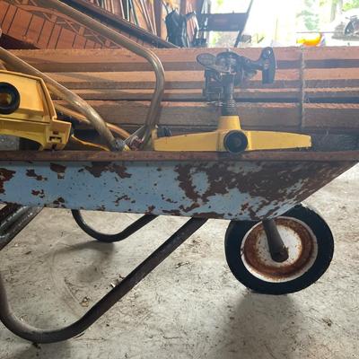 G26-Wheelbarrow, stakes, sprinklers, bird feeder