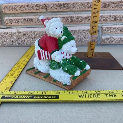 Resin polar bear on sled figurine