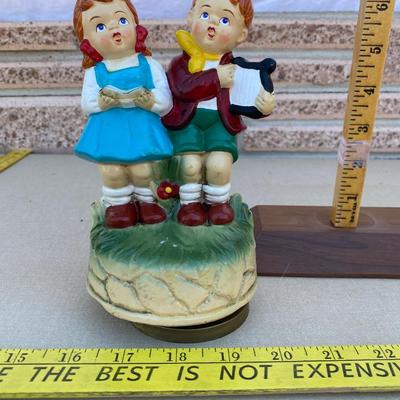Two little kids making music, music box
