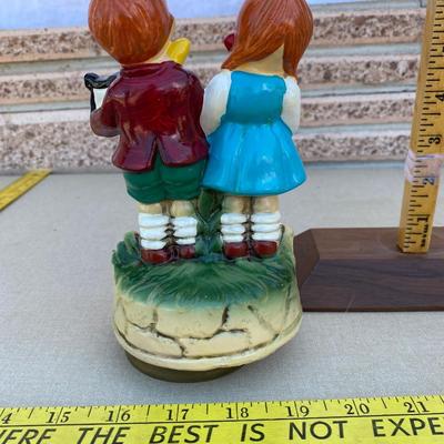 Two little kids making music, music box