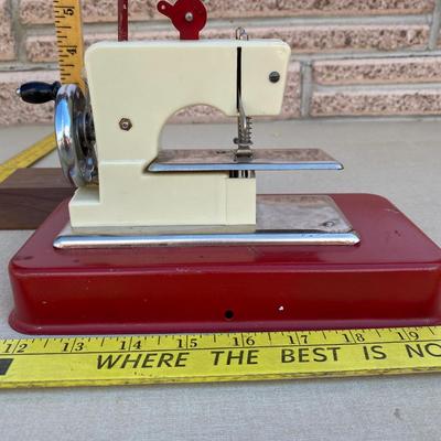 Vintage plastic and metal jet Sew-O-Magic toy sewing machine