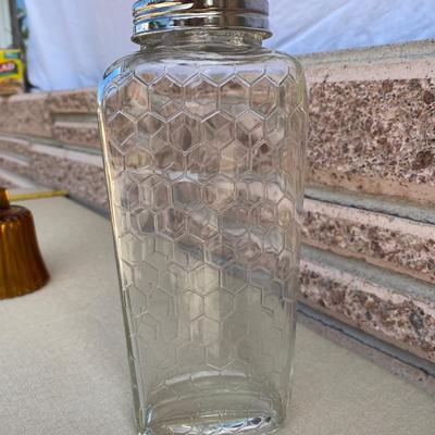 Assortment of glass flower vases and candle holders