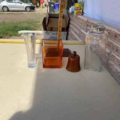 Assortment of glass flower vases and candle holders