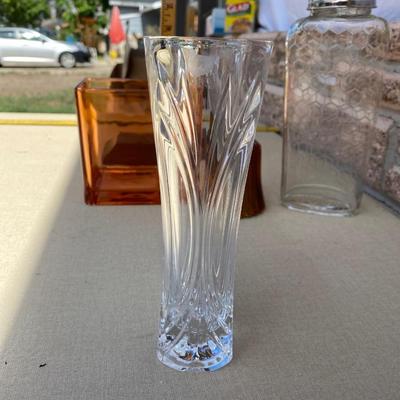 Assortment of glass flower vases and candle holders