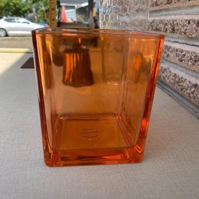 Assortment of glass flower vases and candle holders