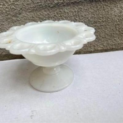 Vintage milk glass candy dish in pedestal.