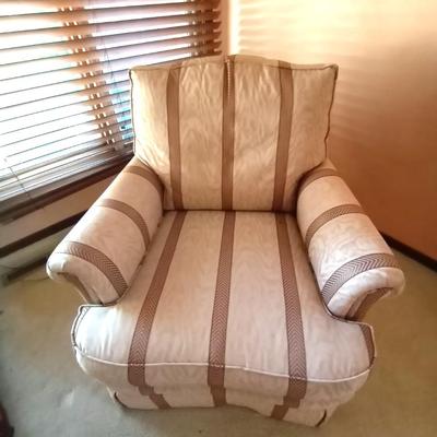 LOT 7 UPHOLSTERED ARMCHAIR AND OTTOMAN 