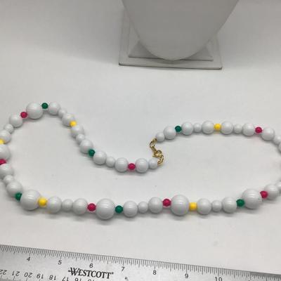White Beaded Necklace. Green pink yellow accent