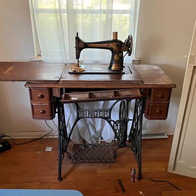 Singer sewing machine with sewing table