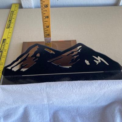 Metal mountain scene with bears